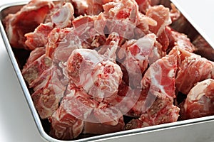 Pork spine on butcher tray