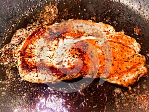 Pork Steak Browned in Cast Iron Skillet