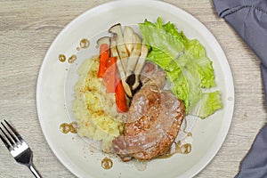 Pork steak with mashed potatoes and mushroom