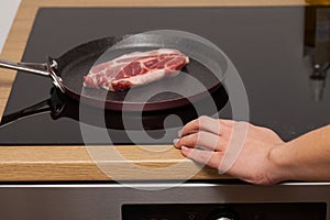Pork steak in non-stick frying pan