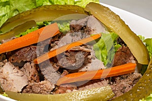 pork steak with pickled carrots and cucumbers