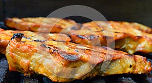 Pork steaks on a grill