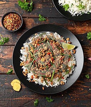 Pork Stir Fry with Green Beans, rice, garlic, chili and ginger. Asian food.