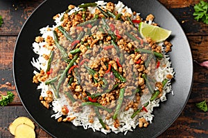 Pork Stir Fry with Green Beans, rice, garlic, chili and ginger. Asian food.