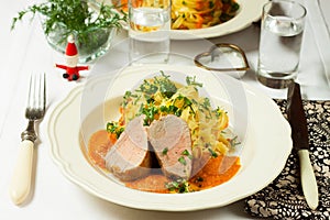 Pork with tagliatelli and sauce photo