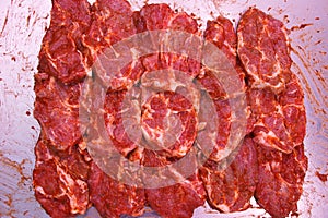 Pork tenderloin steaks laid out together
