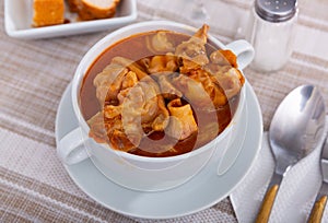 Pork trotter with broth served in bowl