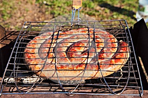 Pork wurst grilled on a coals. Sausages barbecue.