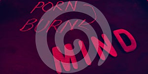 porn burn mind note displayed on pink colour abstract background