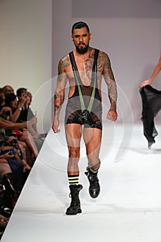 star extraordinaire Boomer Banks walks the runway at the Marco Marco fashion show during SS 2016