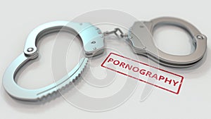 PORNOGRAPHY stamp and handcuffs. Crime and punishment related conceptual 3D rendering