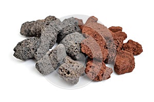 Porous black and brown volcanic rock. Lava stone, pumice stone, or volcanic pumice with distinctive pores