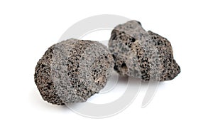 Porous black volcanic rock. Lava stone, pumice stone, or volcanic pumice with distinctive pores