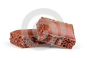 Porous chocolate on white background