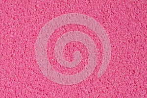 Porous dark pink ethylene vinyl acetate, foam texture.