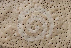 Porous surface of a dough for a pancake