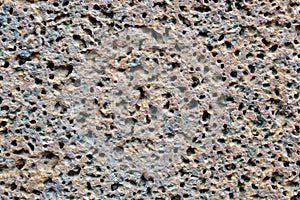 Porous volcanic rock wall.