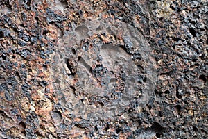 Porous volcanic rock wall, old stone background