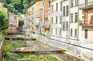 Porretta - Bologna - Reno river tributary canal passing passes through village house