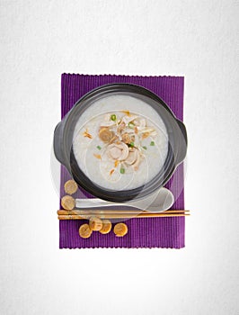 Porridge or abalone porridge in claypot on a background.