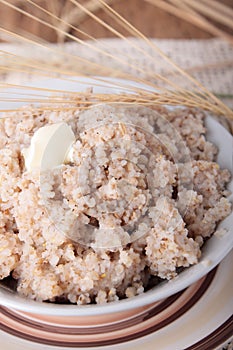 Porridge of crushed barley and butter in bowl