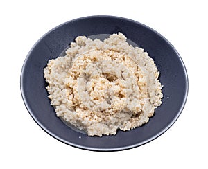 Porridge from crushed pot barley groats isolated