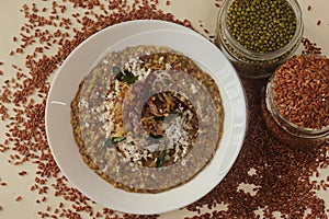 Porridge or gruel made of Navara rice, mung beans and fenugreek seeds sprinkled with fresh grated coconut. Commonly know as navara