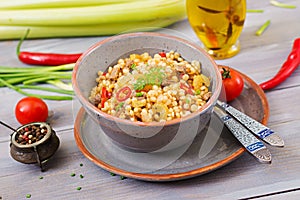 Porridge from Turkish couscous with beef and vegetables