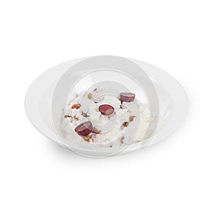 Porridge on a white plate isolated