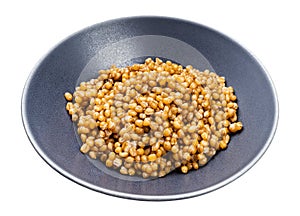 Porridge from whole-grain wheat in gray bowl