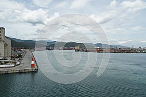 Port basin of Puerto Cabello with moored ships in container and general cargo terminal. photo