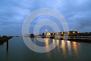 Port for berthing and unloading ships and delivering or collecting the cargo at night