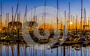 The port of Blankenberge at sunset, many docked boats, beautiful city scenery of a popular town in Belgium