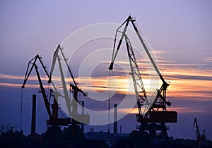 Port cargo crane at sunset