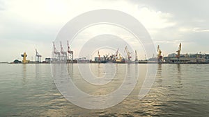Port with cranes, daytime.