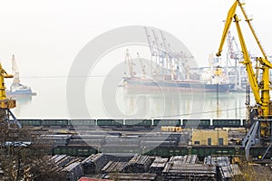 Port with cranes, dock and railway ships