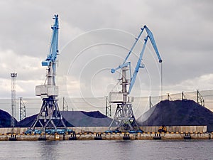 Port cranes for loading and unloading coal into freight trains. Coal transportation