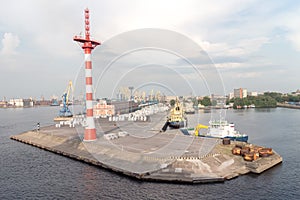 Port cranes with old warehose.