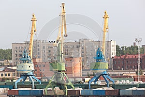 Port cranes with old warehose.