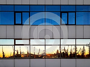 Port cranes reflection