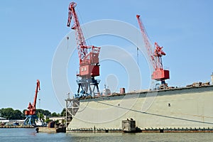 Port cranes and ship dock in port. City Svetlyj, Kaliningrad region