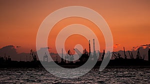 Port Cranes Silhouettes, at Sunset , Thessaloniki