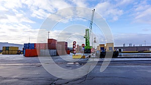 Port cranes and stacks of shipping containers . Shipping Containers . photo