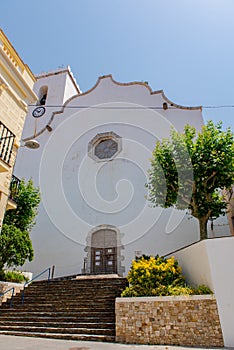 View of The church is dedicated to Santa Maria de les Neus in Port de la Selva, one of the most touristic villages of Costa Brava photo
