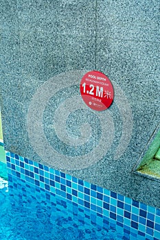 1.2 meters Depth of the hotel pool sign at Lexis Hibiscus Hotel and resorts photo