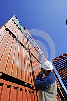 Port and dock worker with cargo containers