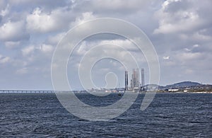 The Port of Dundee with two Oil Rigs alongside for a refit in front of the Tay Rail Bridge.