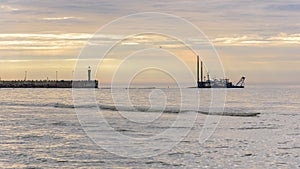 Port entrance in Leba in Poland at sunset