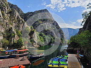 A port full of boats and kayak in Matka Canyon