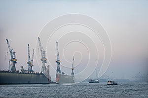 Port of Hamburg with big dock and cranes